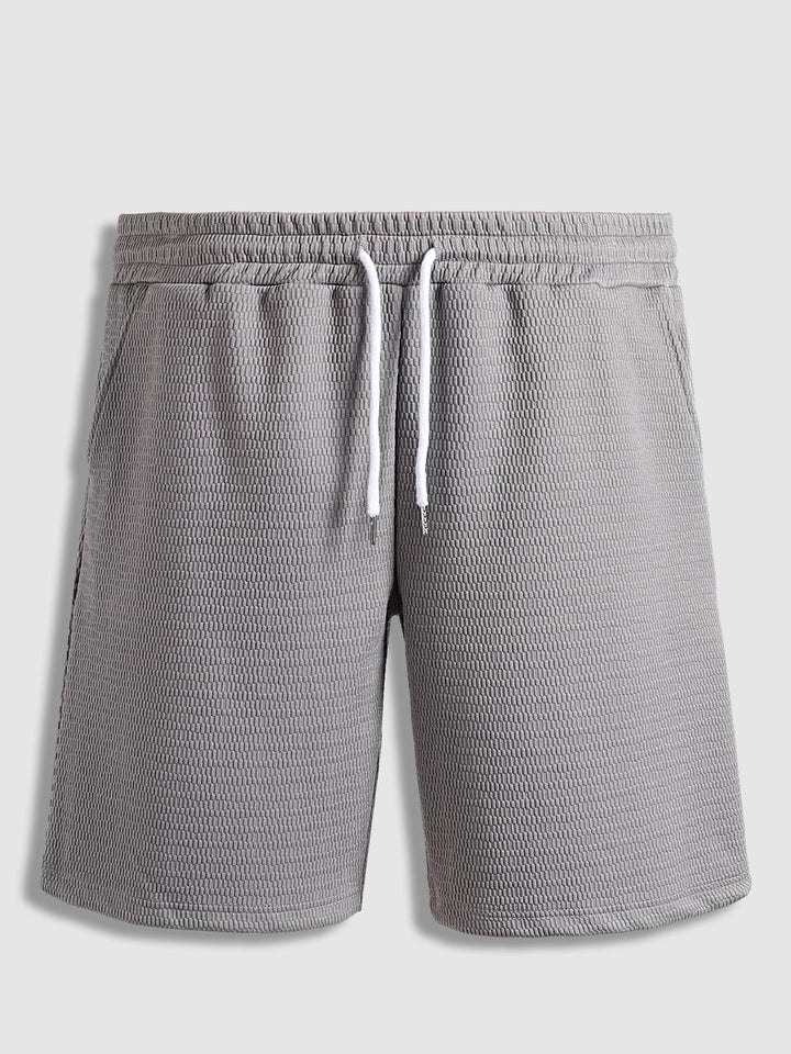 Men's solid color textured elastic waist shorts