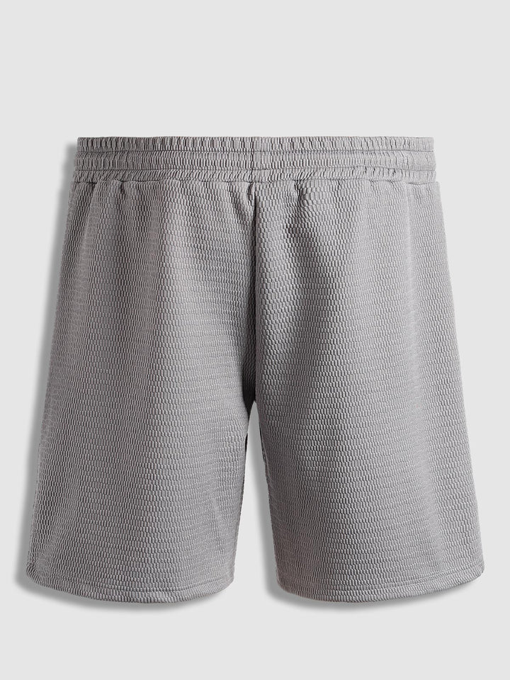 Men's solid color textured elastic waist shorts